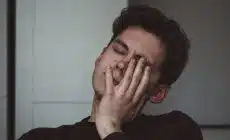 man wearing black crew-neck top