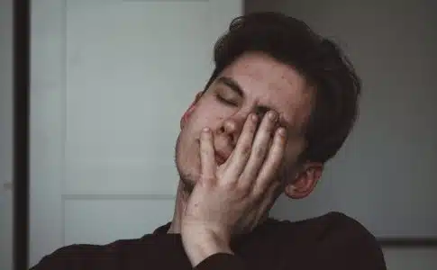 man wearing black crew-neck top