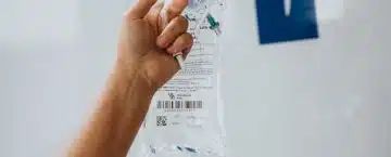 person holding white printer paper